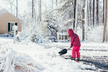child playing with snow