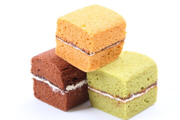 Brownie cheese cake and green tea cake on white background