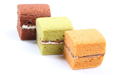 Brownie cheese cake and green tea cake on white background