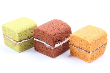 Brownie cheese cake and green tea cake on white background