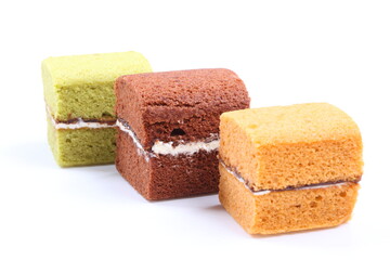 Brownie cheese cake and green tea cake on white background