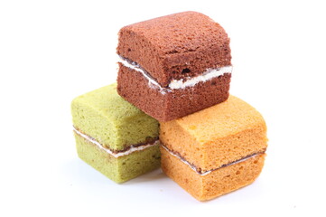 Brownie cheese cake and green tea cake on white background