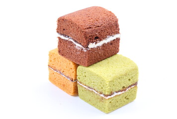 Brownie cheese cake and green tea cake on white background