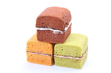 Brownie cheese cake and green tea cake on white background