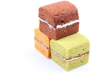 Brownie cheese cake and green tea cake on white background