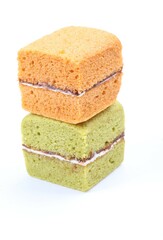 Brownie cheese cake and green tea cake on white background