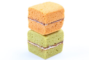Brownie cheese cake and green tea cake on white background