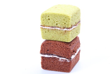 Brownie cheese cake and green tea cake on white background