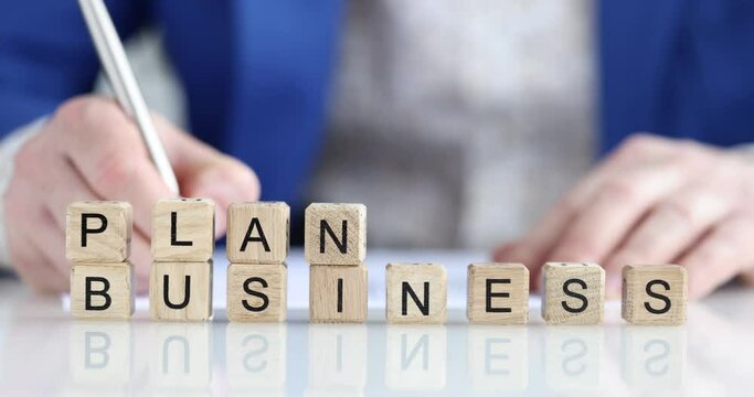 Business plan, block of wooden cubes close up