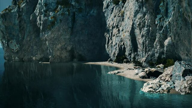 small sand ocean beach near rocky cliff