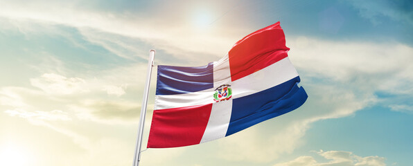 Dominican Republic national flag cloth fabric waving on the sky - Image - obrazy, fototapety, plakaty