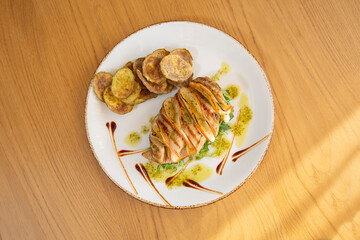 Grilled chicken filet with fried zucchini and arugula