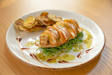 Grilled chicken filet with fried zucchini and arugula