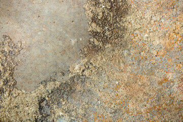 Brown background from decorative plaster with abstract spots. Unusual beige wall texture with beautiful patterns, creative surface background. Front covering for facing of buildings.