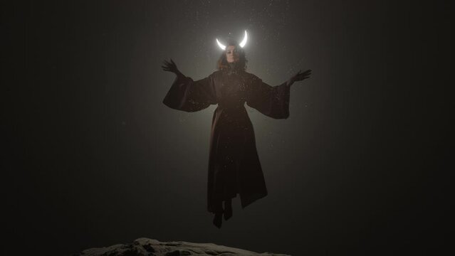The mystical goddess of the night with a shining crescent moon above her head soars above the ground. Live shooting of the model is combined with computer 3D special effects