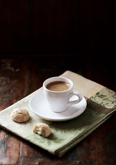Cup of coffee on dark wooden background. Soft focus. Copy space. 