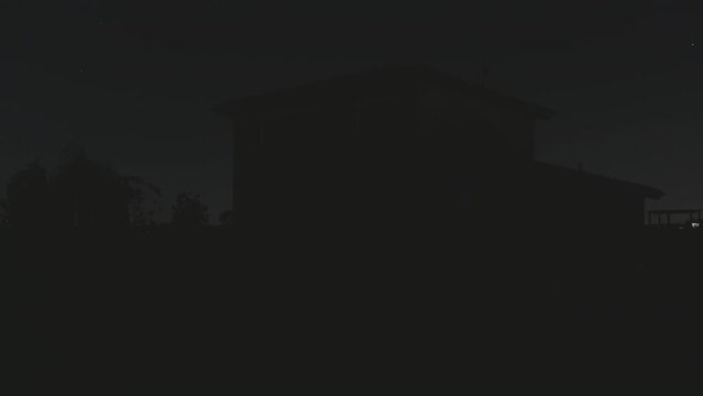 black-out residential house with garden turn off light energy power issue blackout,outdoor view of illuminated independent home at night turning off illumination,energy shortage concept