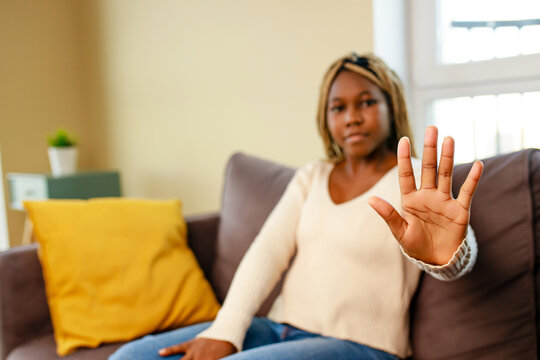 woman showinh hand palm and saying no to domestic violence,abuse and discrimination