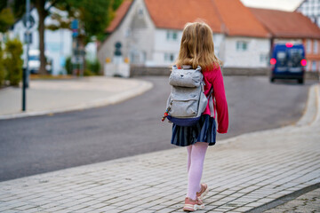 Cute little preschool girl o the way to school Healthy happy child walking to nursery school and...