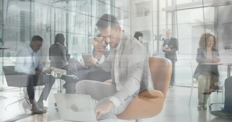 Animation of people walking in fast pace over caucasian businessman working - Powered by Adobe