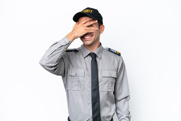 Young safeguard man over isolated white background covering eyes by hands and smiling