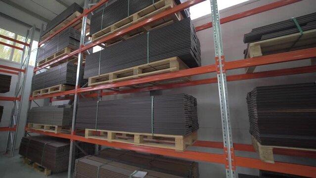A large stock of composite boards. All products are packed in cardboard. Close up