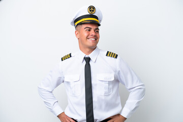 Airplane pilot caucasian man isolated on white background posing with arms at hip and smiling