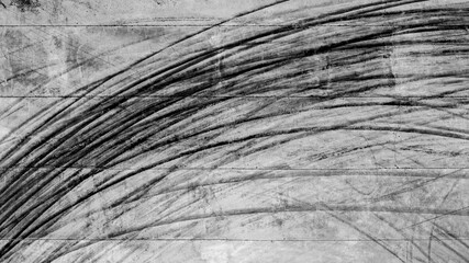 Aerial top view texture car skid tire marks on race track, Black tire mark tread marks on race track texture and background.
