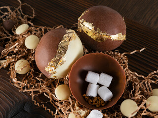 Dessert chocolate bombs with marshmallows in decorative design