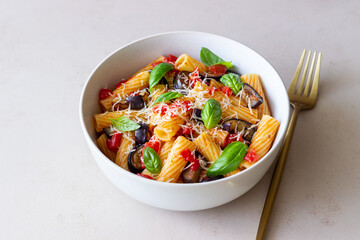 Pasta alla Norma with eggplant, tomatoes, cheese and basil. Italian food. Vegetarian food.