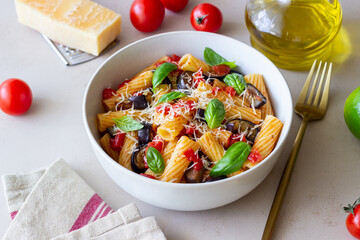 Pasta alla Norma with eggplant, tomatoes, cheese and basil. Italian food. Vegetarian food.