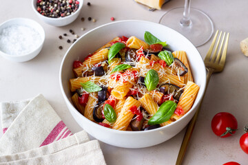 Pasta alla Norma with eggplant, tomatoes, cheese and basil. Italian food. Vegetarian food.