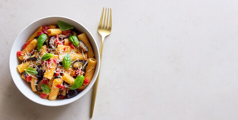 Pasta alla Norma with eggplant, tomatoes, cheese and basil. Italian food. Vegetarian food.