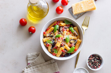 Pasta alla Norma with eggplant, tomatoes, cheese and basil. Italian food. Vegetarian food.
