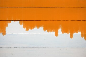 Orange color on painted wooden plank