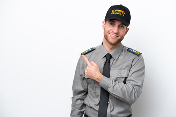 Young safeguard caucasian man isolated on white background pointing to the side to present a product