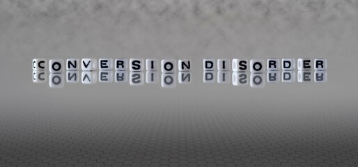conversion disorder word or concept represented by black and white letter cubes on a grey horizon background stretching to infinity