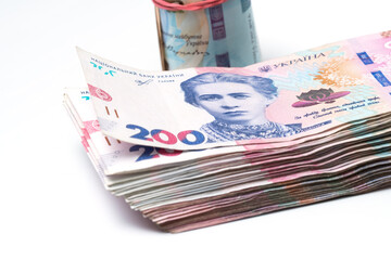 heap of different Ukrainian hryvnia in isolated background