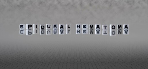 epidural hematoma word or concept represented by black and white letter cubes on a grey horizon...