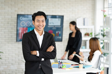 Happy Asian business man meeting in meeting room with partner or colleagues blur background