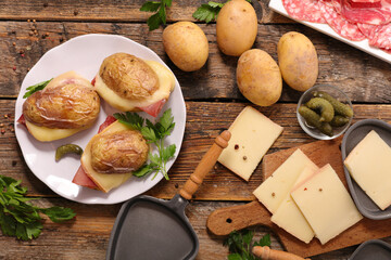 baked potatoes with raclette cheese and salami