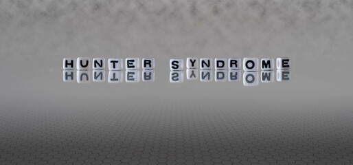 hunter syndrome word or concept represented by black and white letter cubes on a grey horizon...