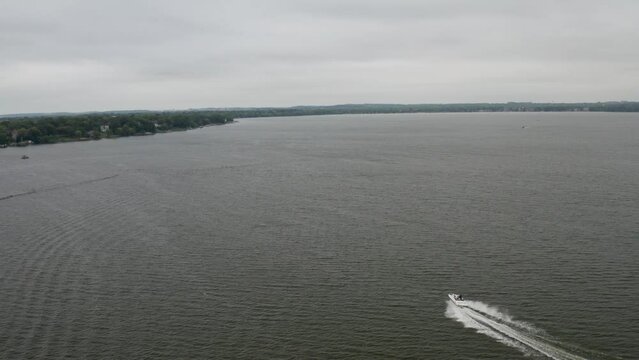Speedboat in Lake Monona in Madison, Wisconsin with drone video following.