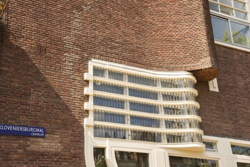 Amsterdam, Netherlands. June 2022. View of the facades of the characteristic brick building of residential complex with Amsterdam School style architecture