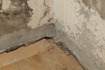 Moisture damage on the wall in the old house and the newly installed insulation of polyethylene...