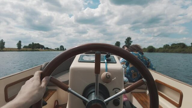 pov shot of a sailor sails small boat through Biesbosch on sunny day Netherlands