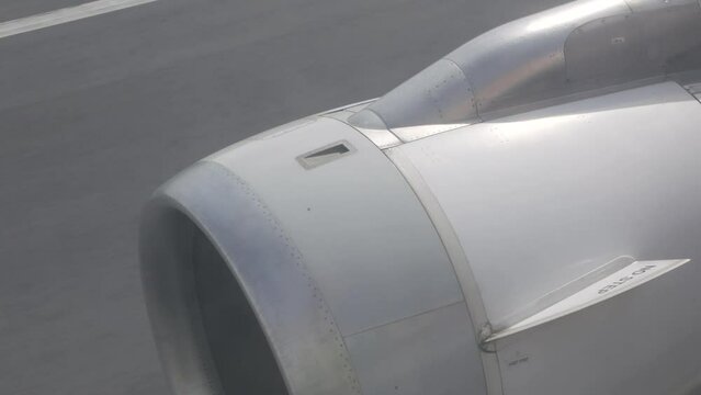 View from in side plane cabin through plane window see plane's engine