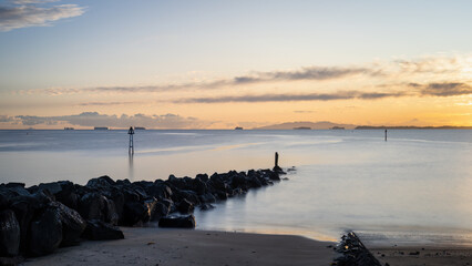 Tranquillity image of Milford beach at dawn, Auckland.
