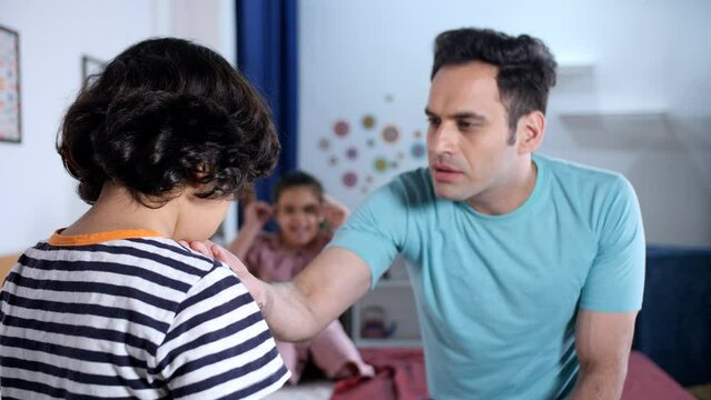A strict Indian father scolding his school-going son - stubborn child  kids mistake  depressed kid  strict parent  discipline issues . Father-son hate relationship - distancing from parent  strict ...