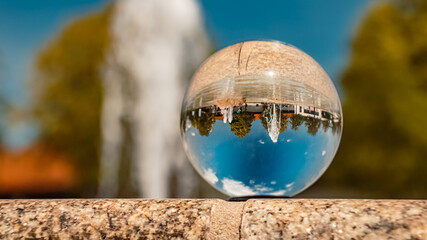 Crystal ball landscape shot with a water fountain at the famous Therme Bad Griesbach, Bavaria, Germany